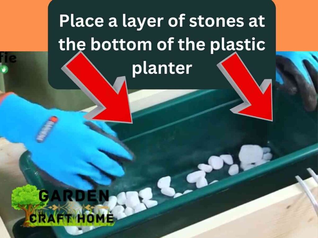 Place a layer of stones at the bottom of the plastic planter