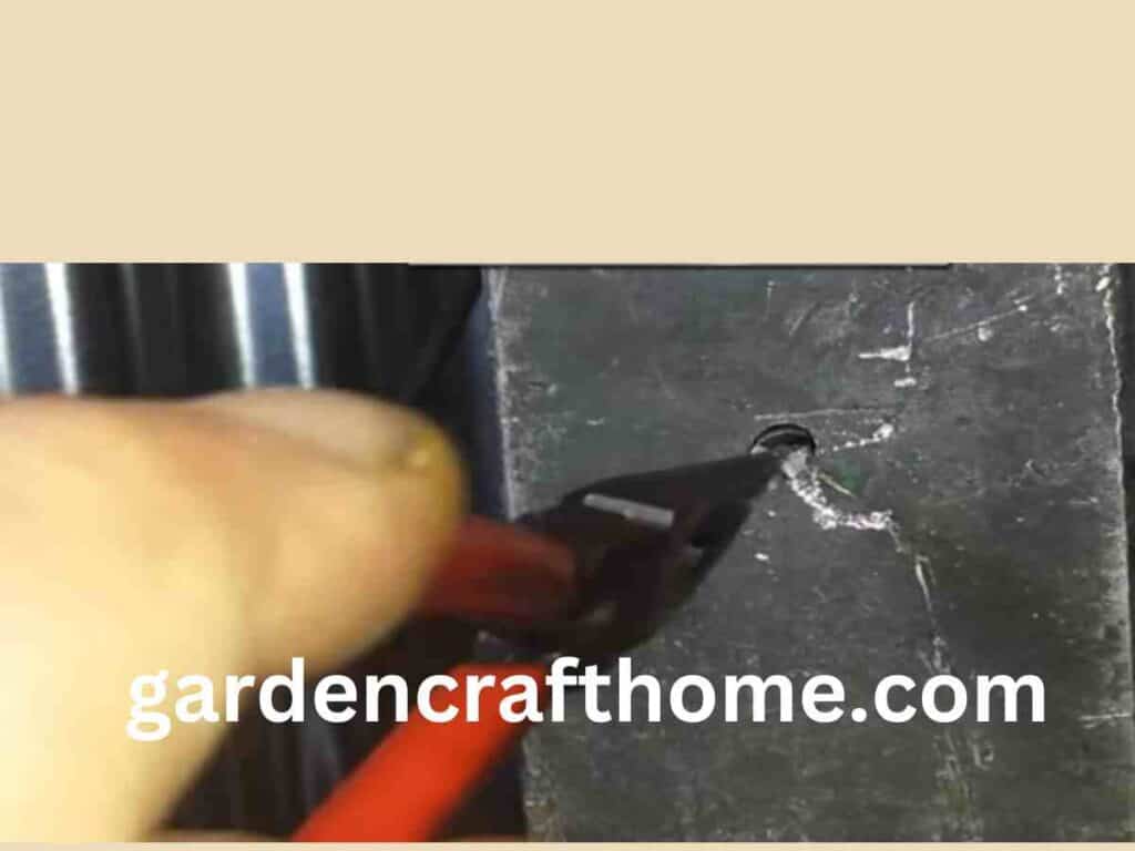 Get Broken Drill Bit Out Of Metal By Using Pliers.